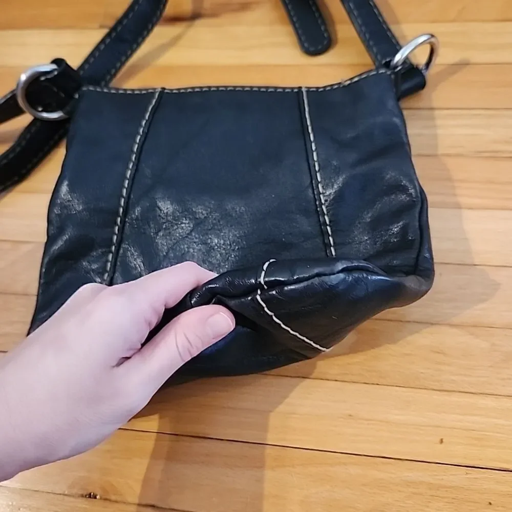 Tignanello black leather Crossbody purse W/accent stitching